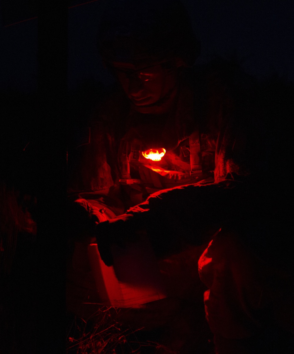Soldiers conduct night land navigation for EIB
