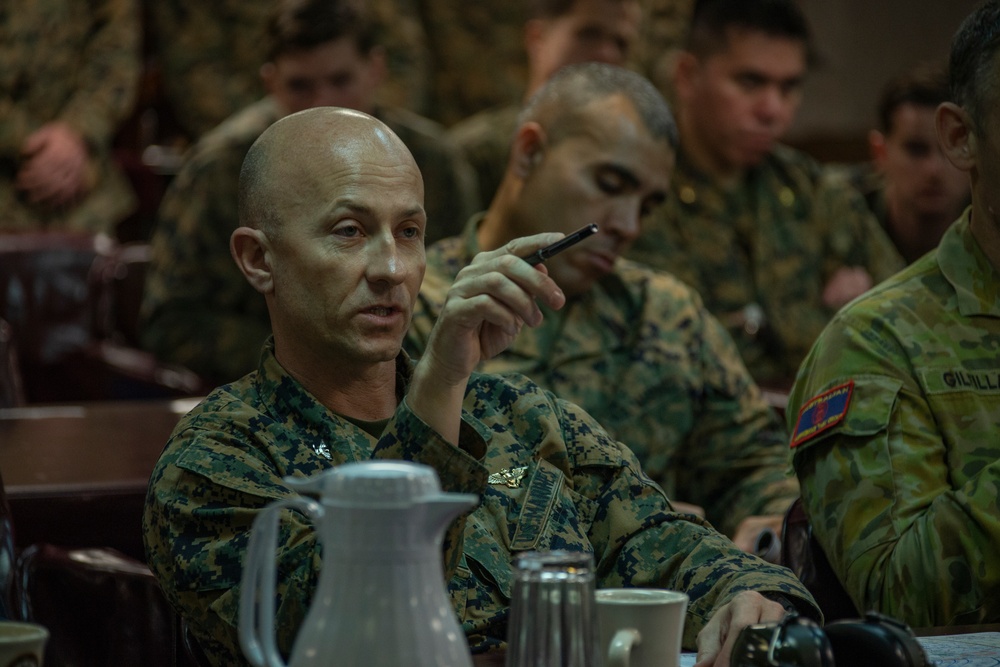 Commanders attend mission brief aboard USS Wasp