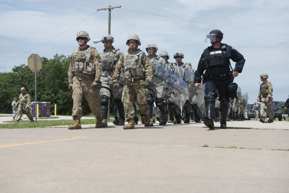 Guardsmen and Wisconsin State patrol conduct riot-control training at PATRIOT North 19