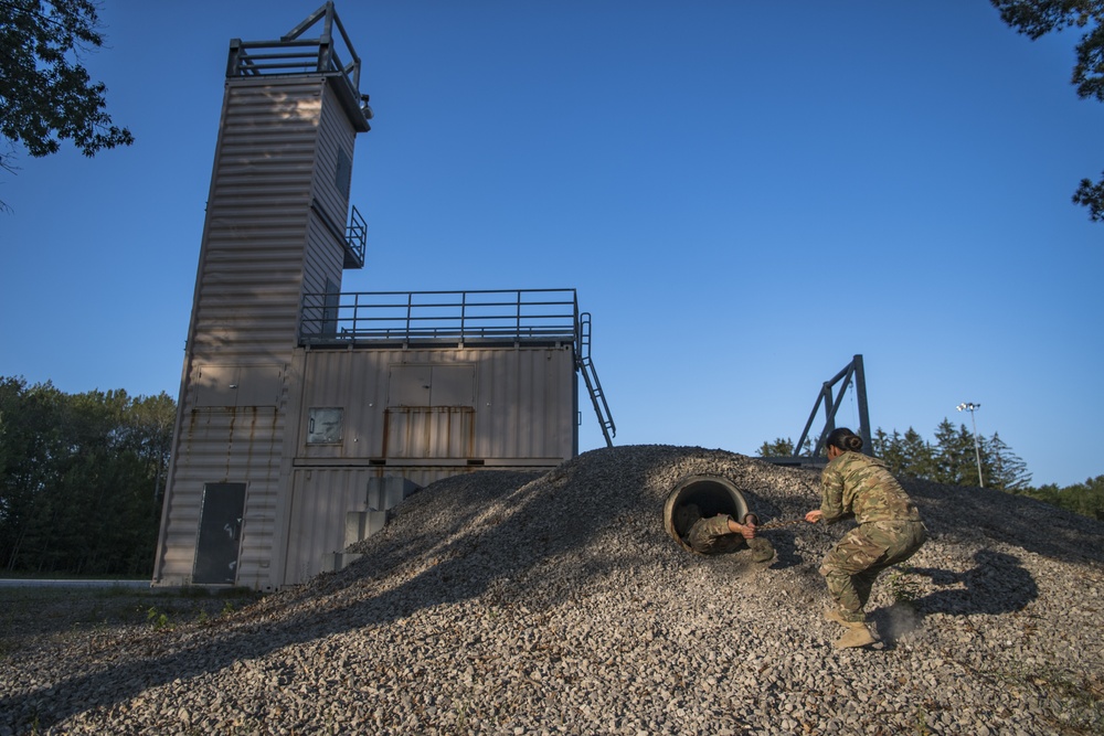 Spc. Laura Adair practices pulling a casualty through a tunnel at Northern Strike 19