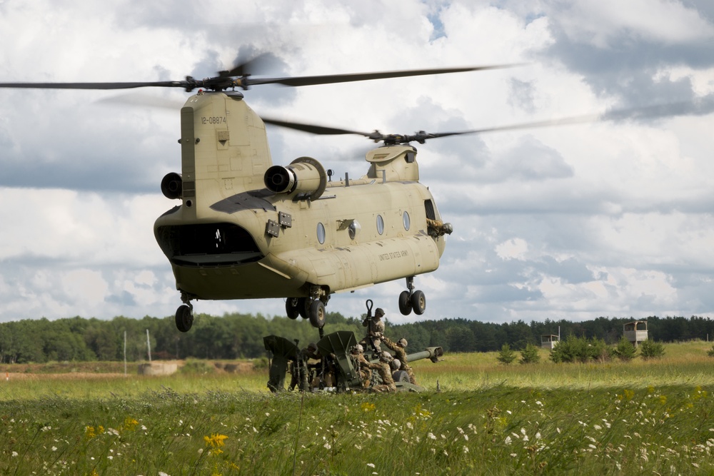 Soldiers Sling Load Howitzer