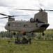 Soldiers Hook Up Howitzer to Chinook