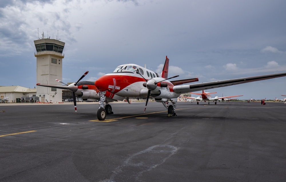 A T-44C Pegasus Parked in Front of the Air Traffic Control Tower Aboard NAS Corpus Christi