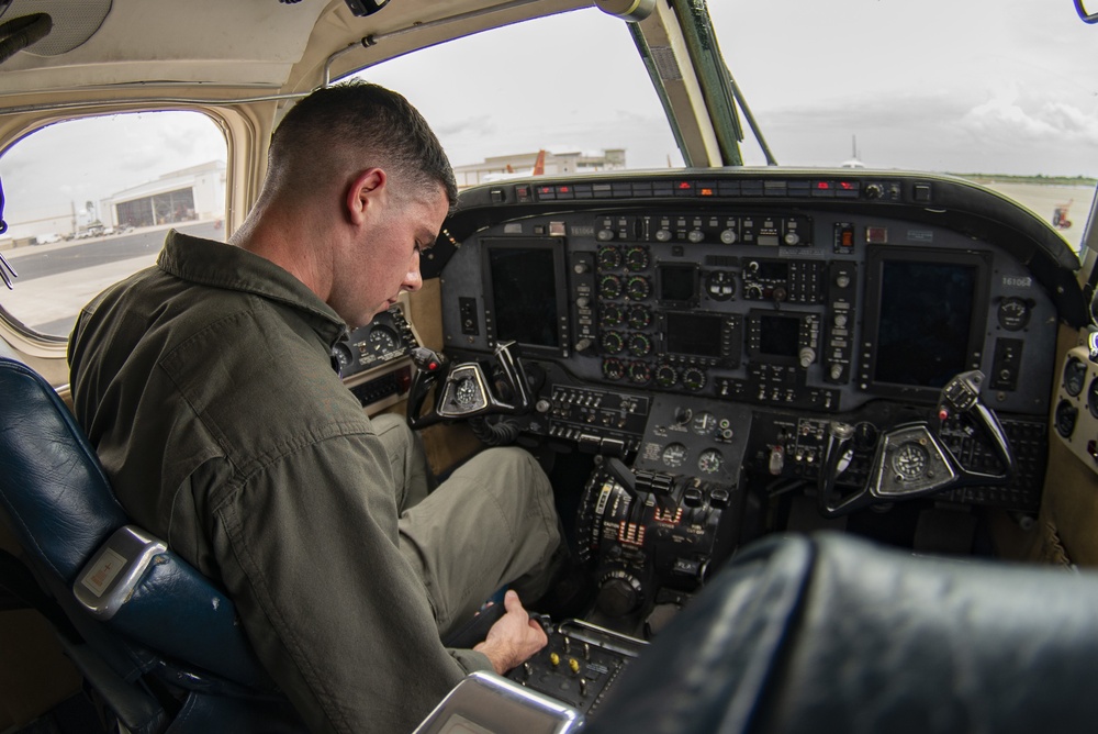 A Marine Student Pilot Conducts His Preflight Checklist Prior to a Flight in a T-44C Pegasus