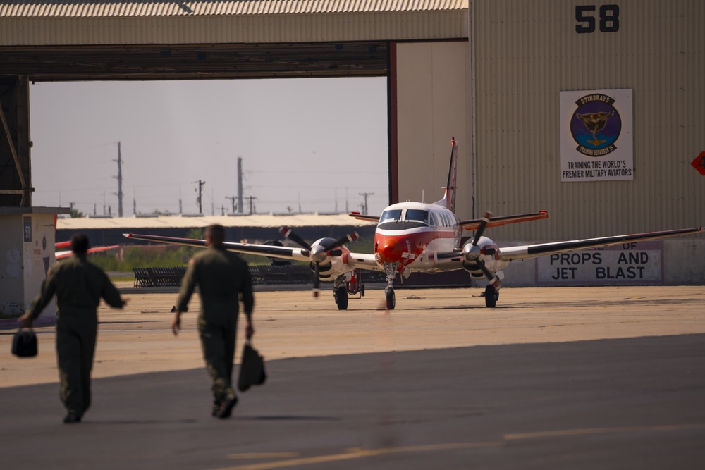 A Student and Instructor Pilot Walk Towards the VT-35 Hanger After a Flight Aboard NAS Corpus Christi