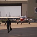 A Student and Instructor Pilot Walk Towards the VT-35 Hanger After a Flight Aboard NAS Corpus Christi
