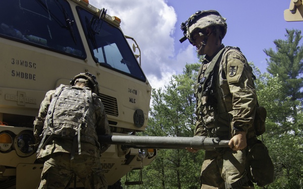 Soldiers prepare LMTV for towing