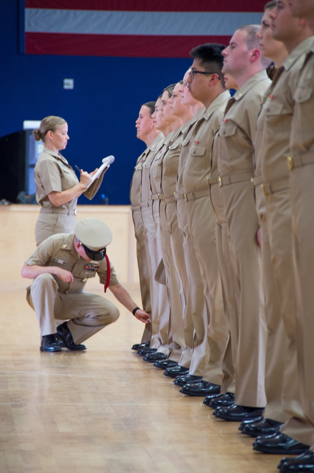 NEWPORT, R.I. (July 25, 2019) – Students of Officer Development School (ODS) class 19-050 get their service khaki uniforms inspected at Officer Training Command, Newport on July 25, 2019.