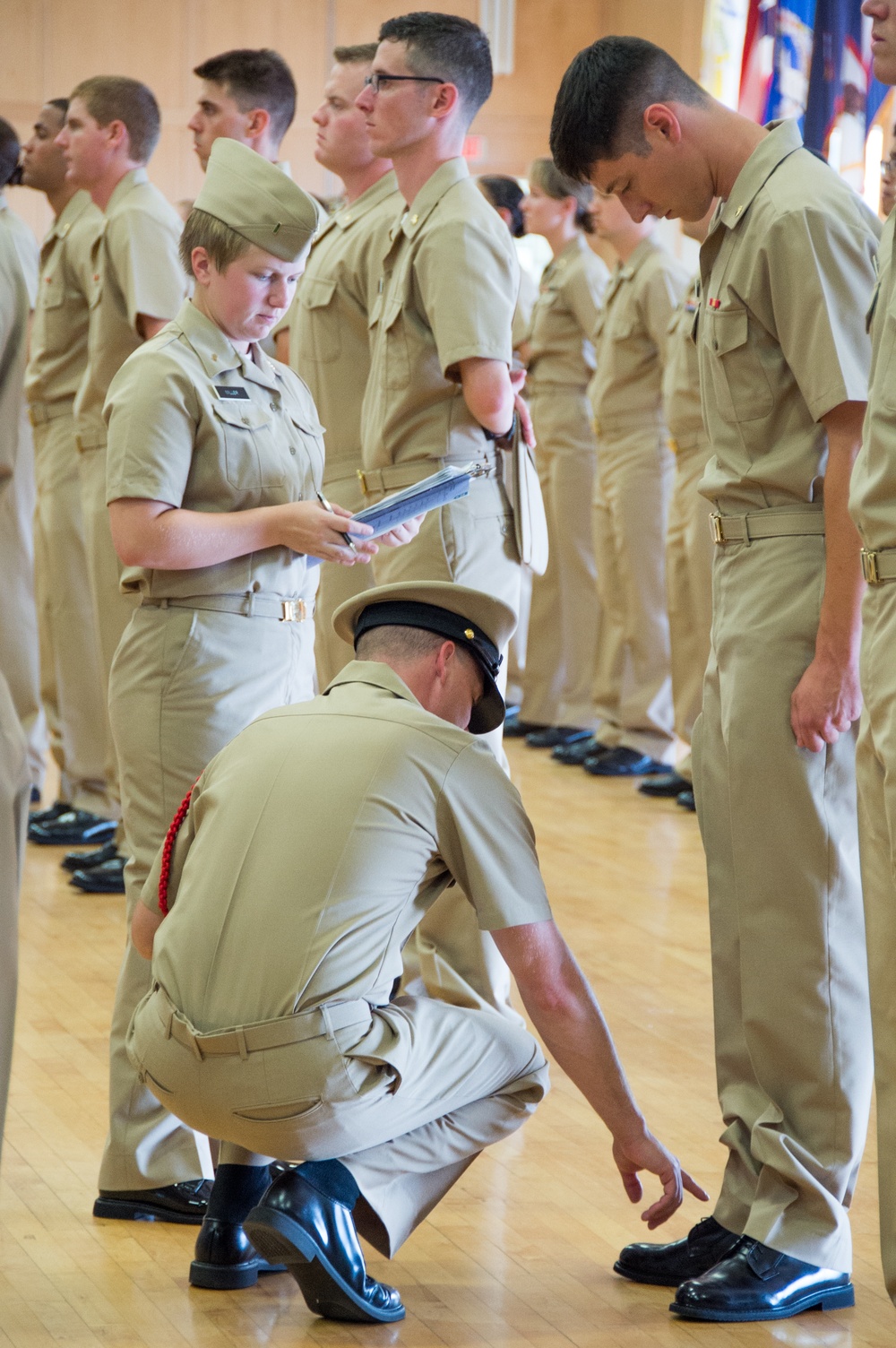 NEWPORT, R.I. (July 25, 2019) – Students of Officer Development School (ODS) class 19-050 get their service khaki uniforms inspected at Officer Training Command, Newport on July 25, 2019.