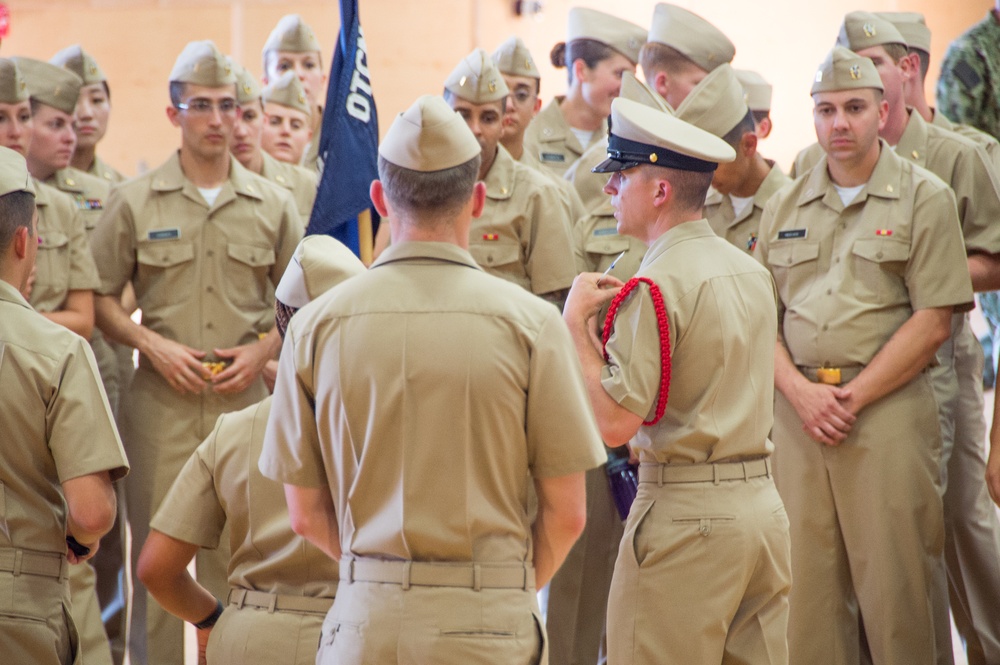 NEWPORT, R.I. (July 25, 2019) -- Chief Hospital Corpsman Aaron S. Paul, a Recruit Division Commander here at Officer Training Command, teaches the proper wear of the service khaki to the students of Officer Development School on July 25, 2019.
