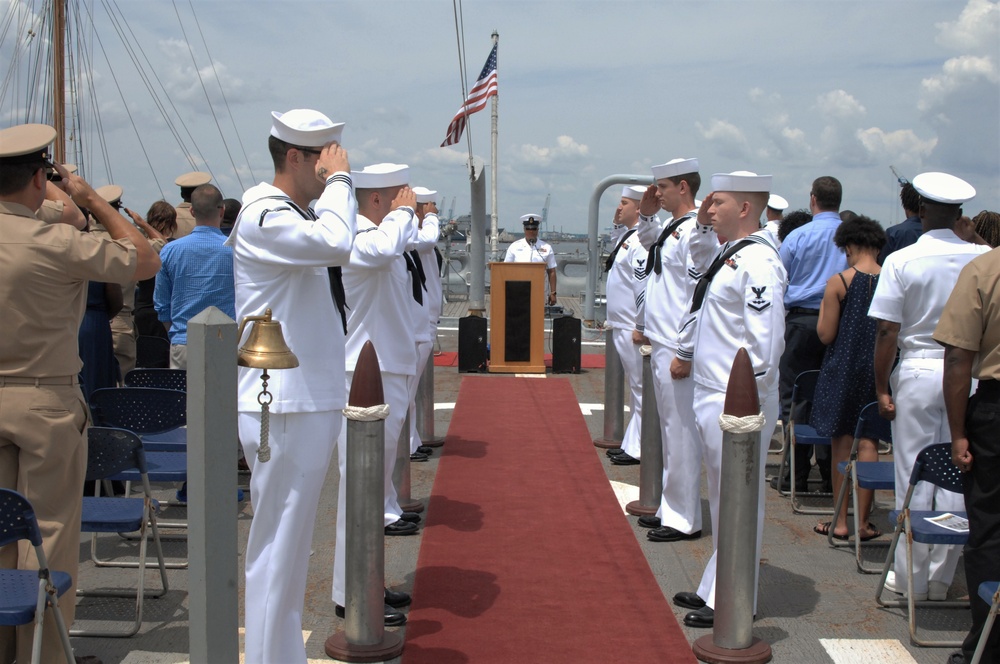 At attention during the National Anthem