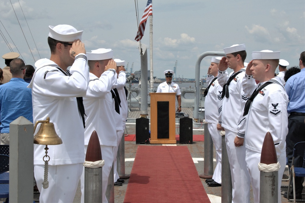 Sailors at attention at during the National Anthem