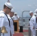 Sailors bow their heads during the Chaplain's invocation