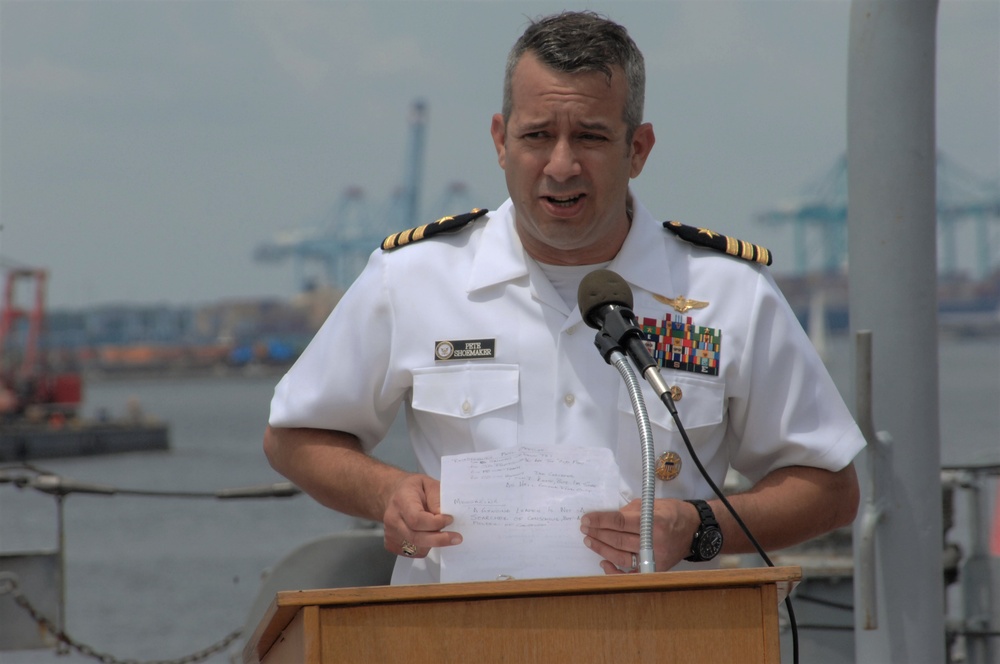 Former VFA-37 Commanding Officer speaks during a commissioning ceremony