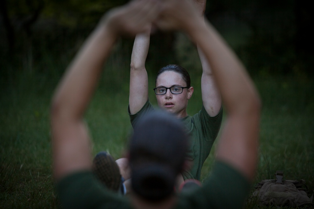 Marine Corps officer candidates run the Muscle Endurance Course