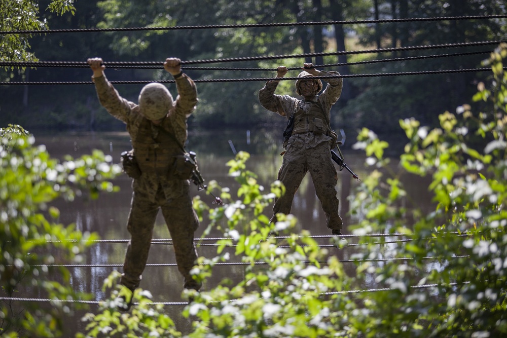 Marine Corps officer candidates push through the Combat Course