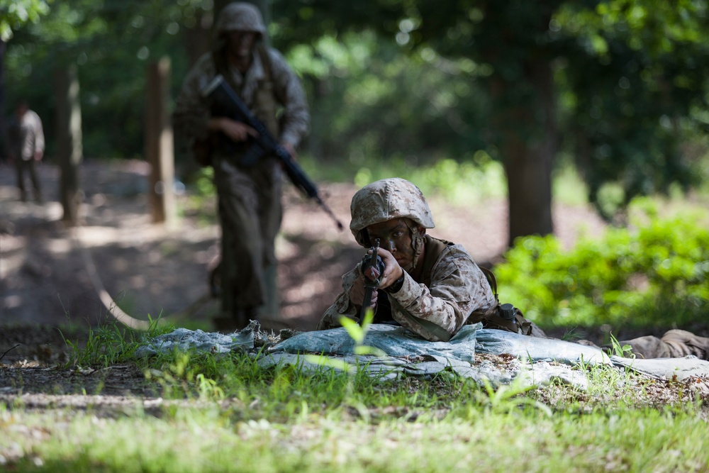 Marine Corps officer candidates push through the Combat Course