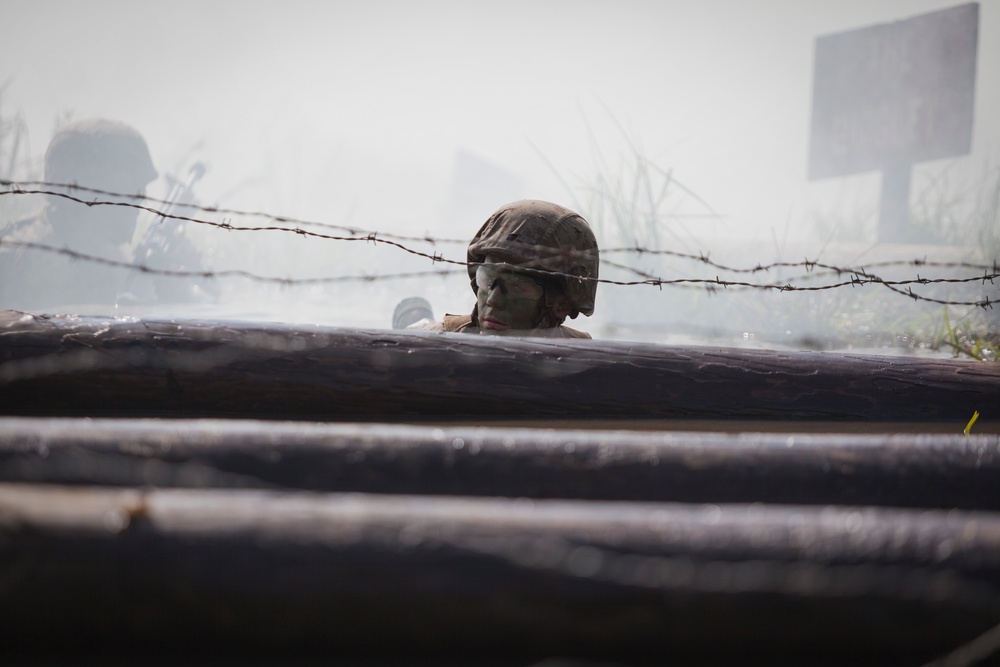 Marine Corps officer candidates push through the Combat Course