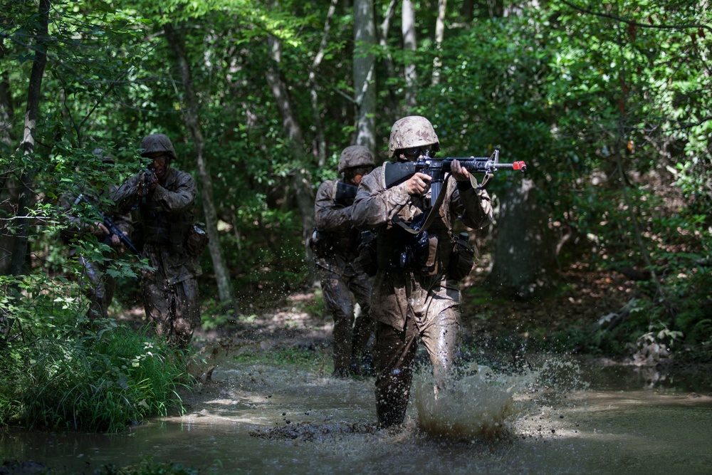 Marine Corps officer candidates push through the Combat Course