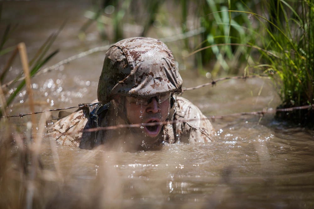 Marine Corps officer candidates push through the Combat Course