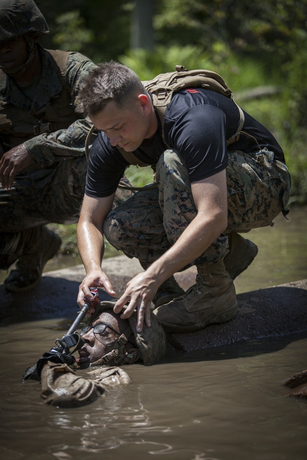 Marine Corps officer candidates push through the Combat Course
