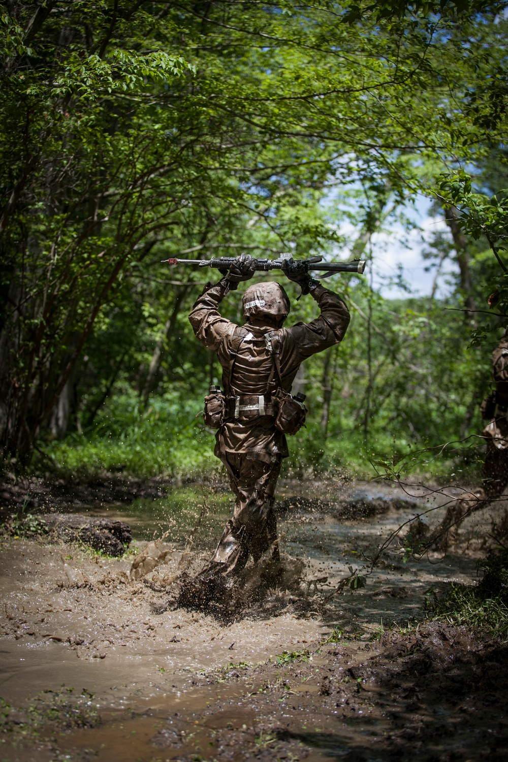 Marine Corps officer candidates push through the Combat Course