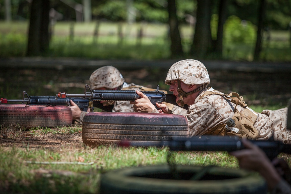 Marine Corps officer candidates practice fire and movement drills