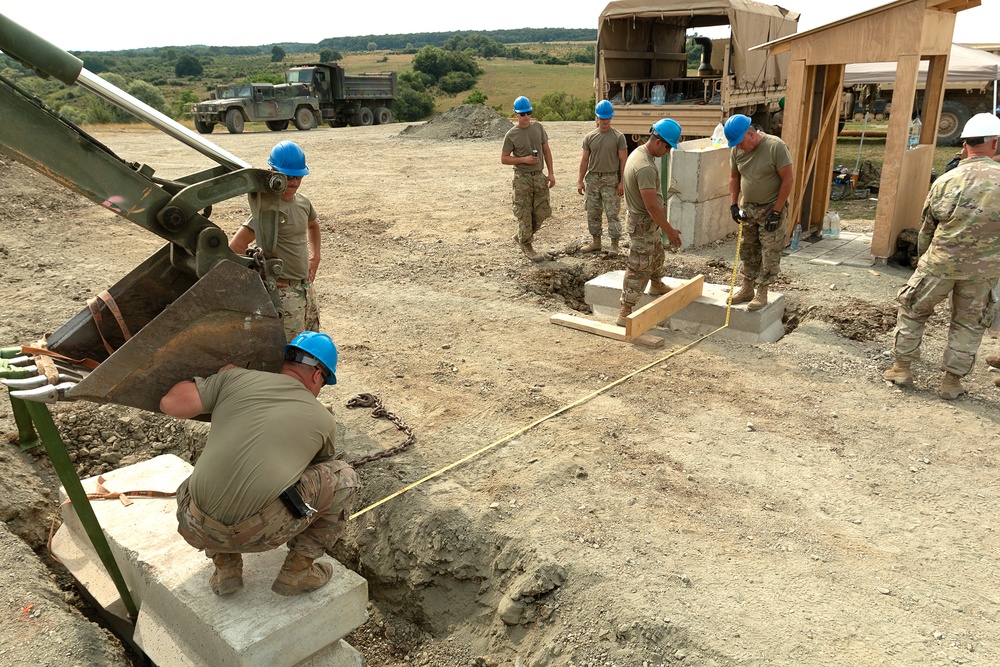 861st Engineers Place Concrete Barriers at Entry Control Point