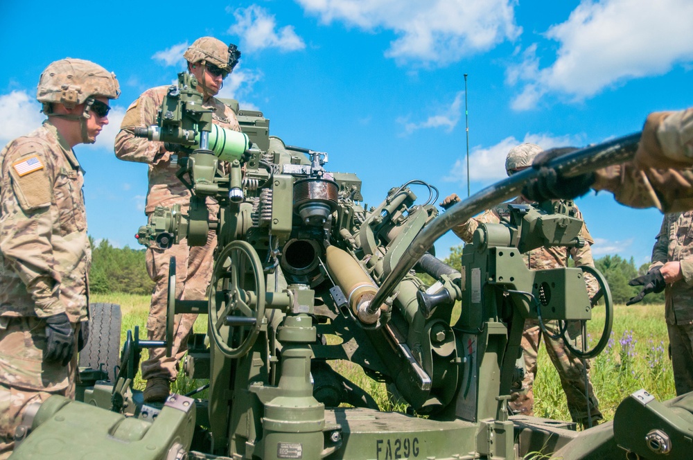 Soldiers Load M777 Howitzer