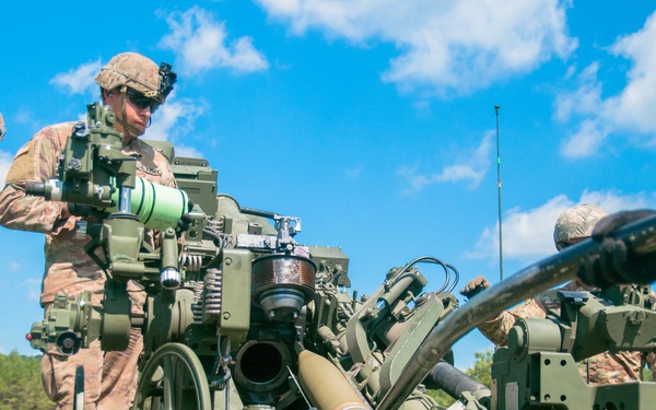 Soldiers Load M777 Howitzer