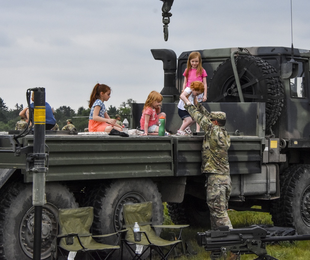 Children and Army trucks