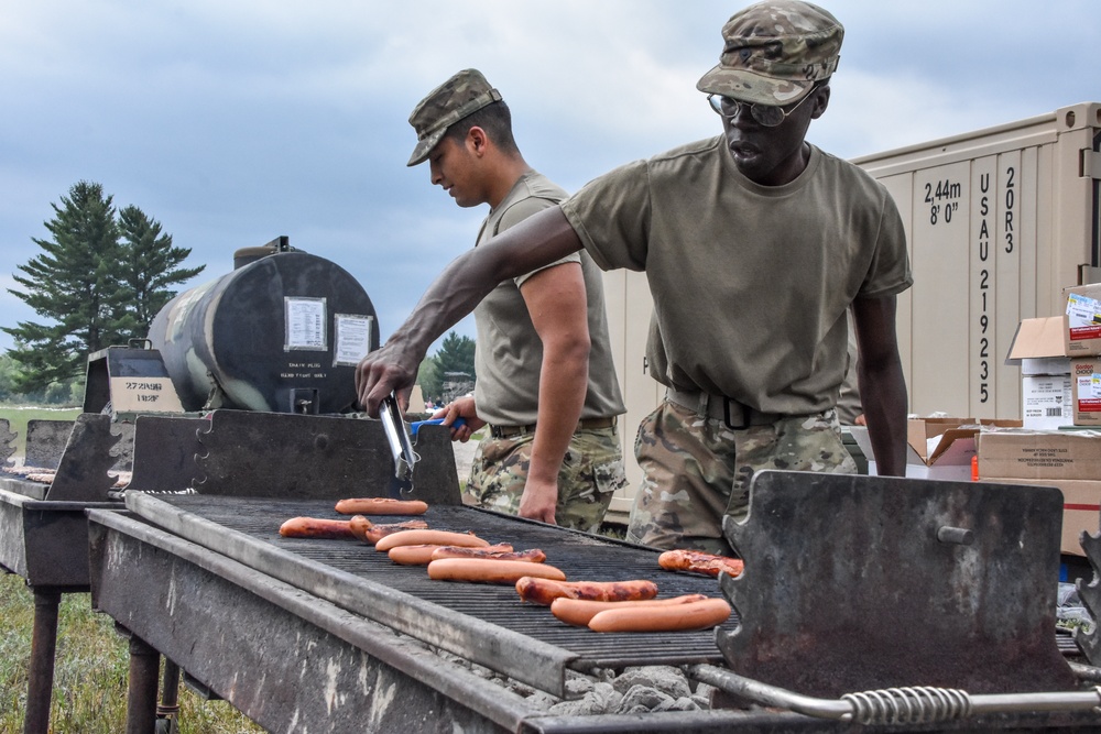 Army cooks working the grill