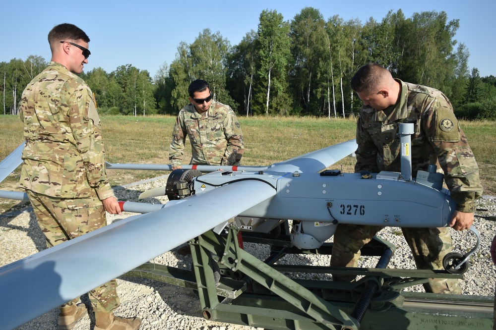 Soldiers mount a RQ-7B Shadow tactical unmanned aircraft system onto the hydraulic launcher.