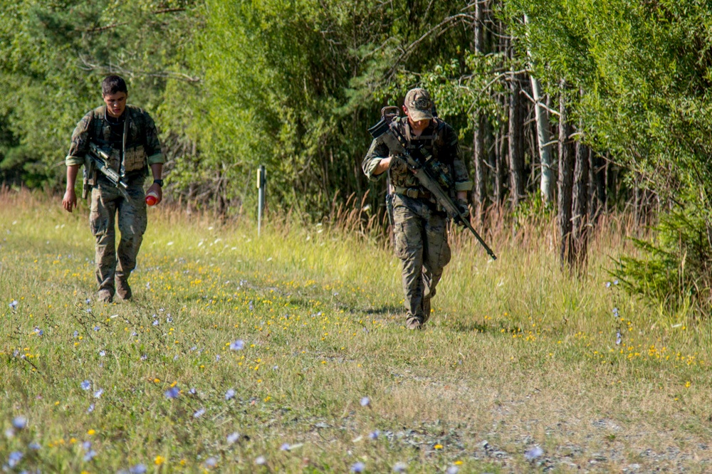 Spain team performs ruck march during the European Best Sniper Competition.