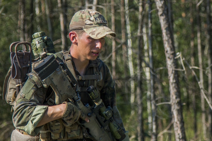 Cpl. Andres Nanez rucks through Grafenwoehr, Germany, representing Spain during the European Best Sniper Competition.