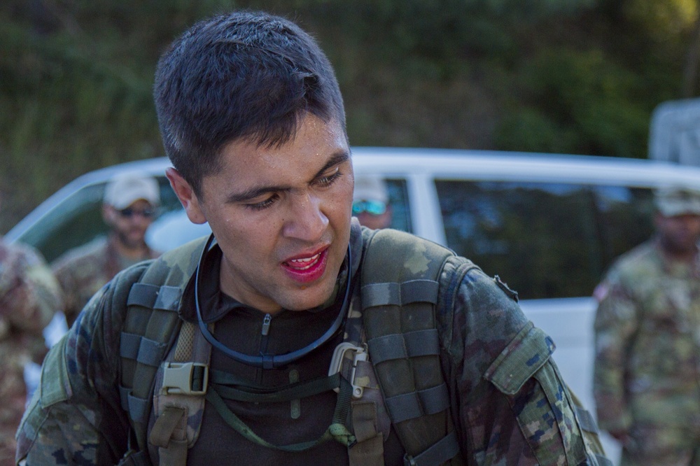 Cpl. Janer Paez complete the ruck march for the European Best Sniper Competition, Grafenwoehr, Germany, July 25, 2019.