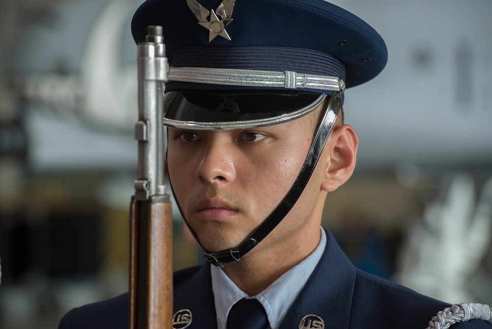 Whiteman AFB Honor Guardsman presents arms while practicing for an active-duty funeral ceremony