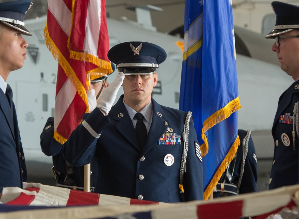 Whiteman AFB Honor Guardsman salutes flag during ceremony practice