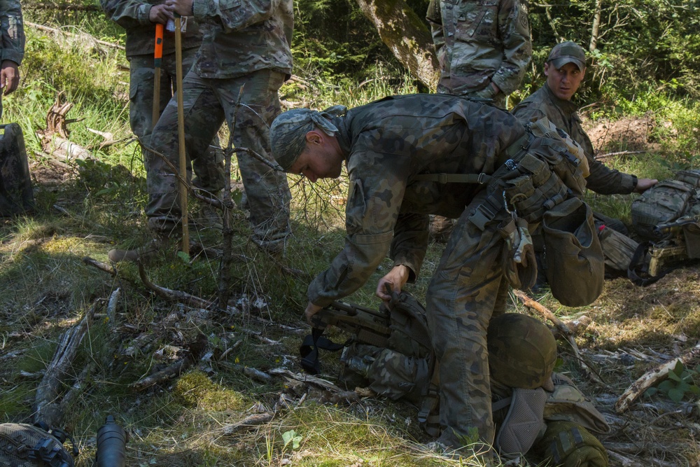 A Polish soldier checks his equipment before the stalking event during the European Best Sniper Competition, Grafenwoehr, Germany, July 23, 2019.