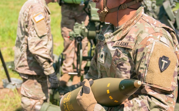 Student cannoneer carries projectile during culminating LFX