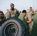 U.S. Army paratroopers flip LMTV tire