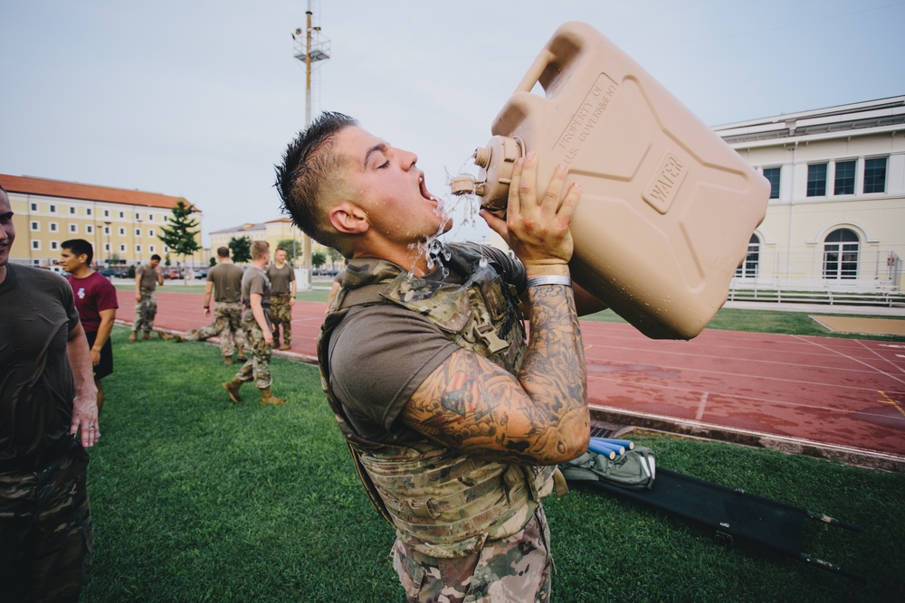 U.S. Army paratrooper hydrates during physical fitness event