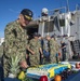 Rear Adm. Edward Cashman Cuts Cake Aboard USS Gravely (DDG 107)