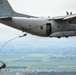 Italian Soldiers jump from a C-27J Spartan.