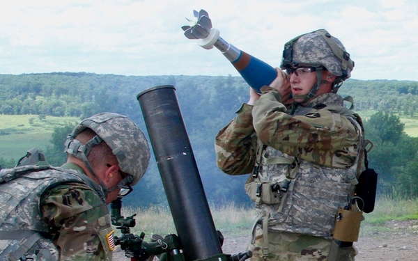 Infantryman loads mortar tube at XCTC