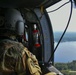 UH-60 Crew Chief looks out over one of Camp Grayling's surrounding lakes