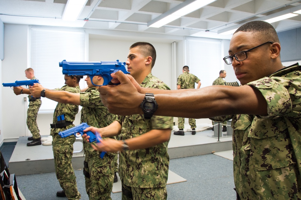 Officer Candidate School (OCS) class 15-19 candidates practice safe weapons handling at Officer Training Command (OTCN) in Newport, Rhode Island on July 30, 2019.