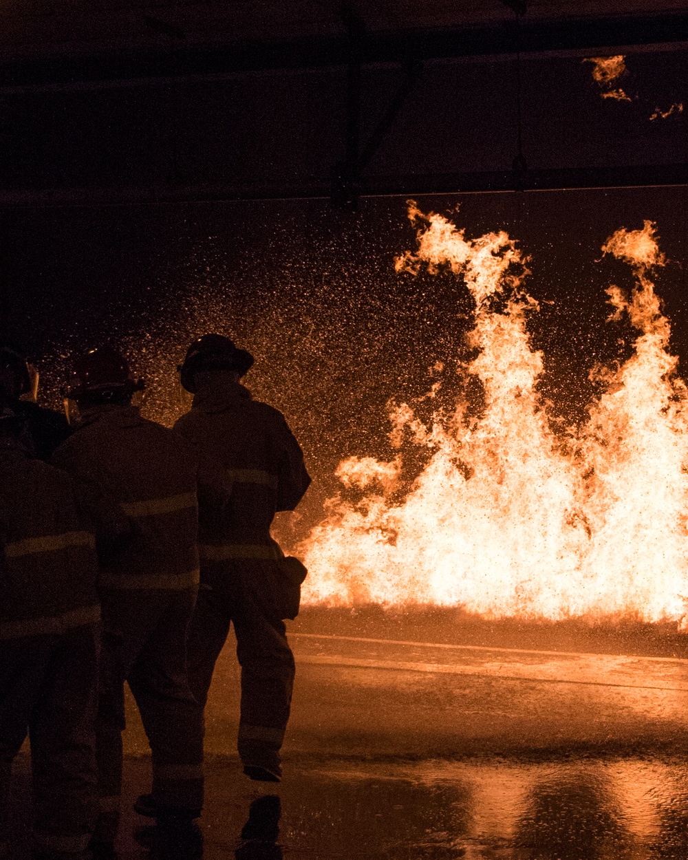 Officer Development School (ODS) class 19-050 here at Officer Training Command, Newport, Rhode Island, conduct shipboard firefighting training July 30, 2019.