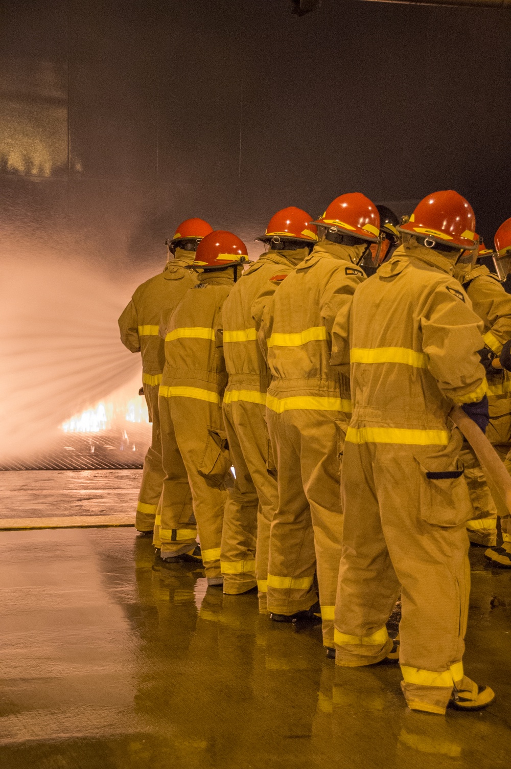 Officer Development School (ODS) class 19-050 here at Officer Training Command, Newport, Rhode Island, conduct shipboard firefighting training July 30, 2019.