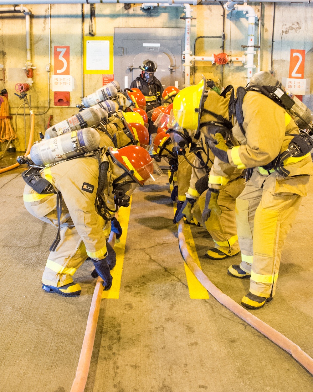 Officer Development School (ODS) class 19-050 here at Officer Training Command, Newport, Rhode Island, conduct shipboard firefighting training July 30, 2019.